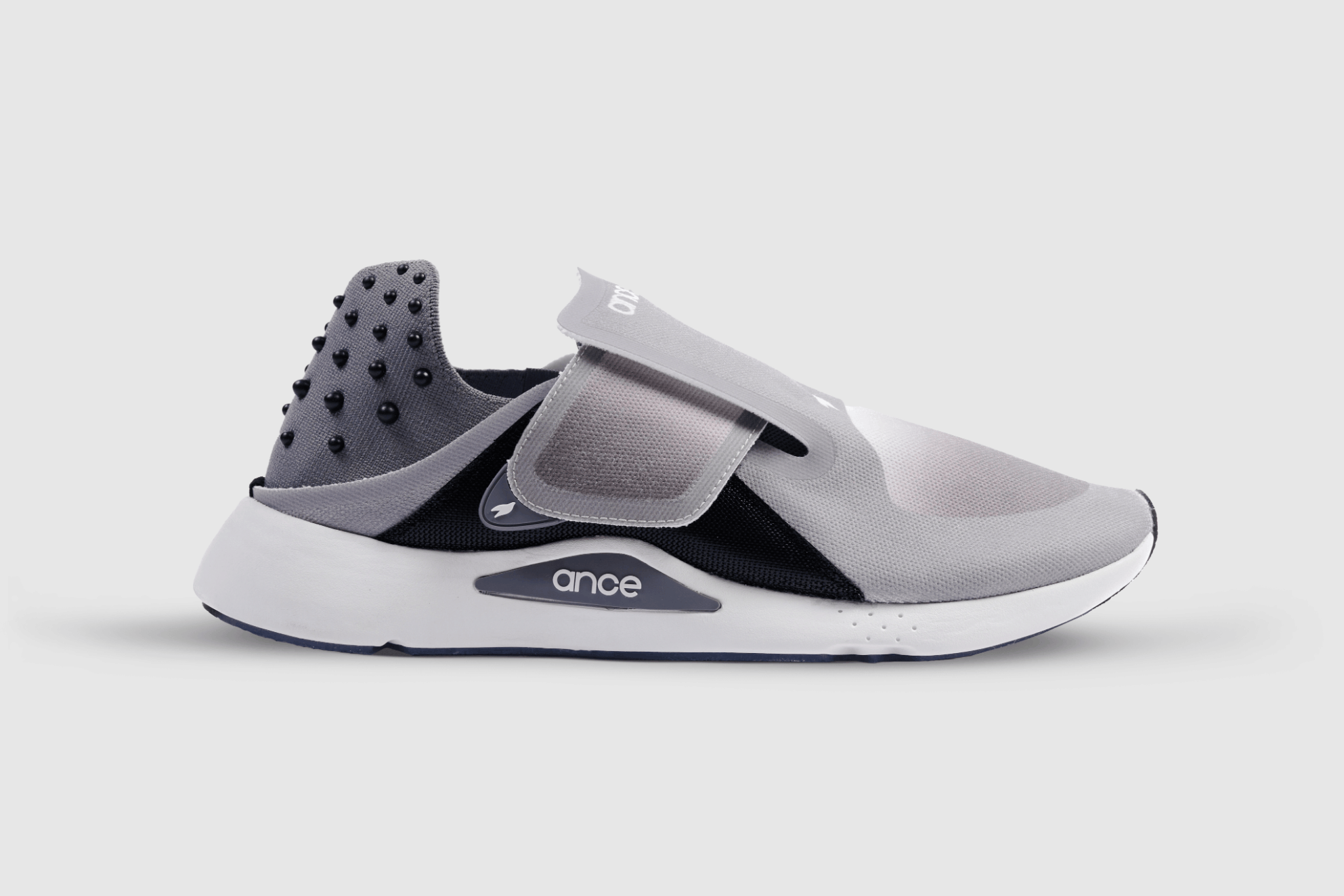 Grey recovery shoes with a 360-degree strap, acupressure dots, a wide toe box, and an integrated icing system