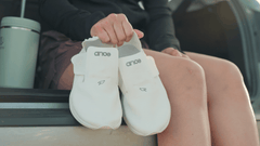 White recovery shoes designed for complete recovery on the go